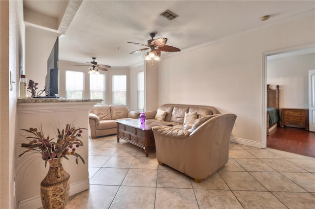 tiled living room featuring crown molding and ceiling fan