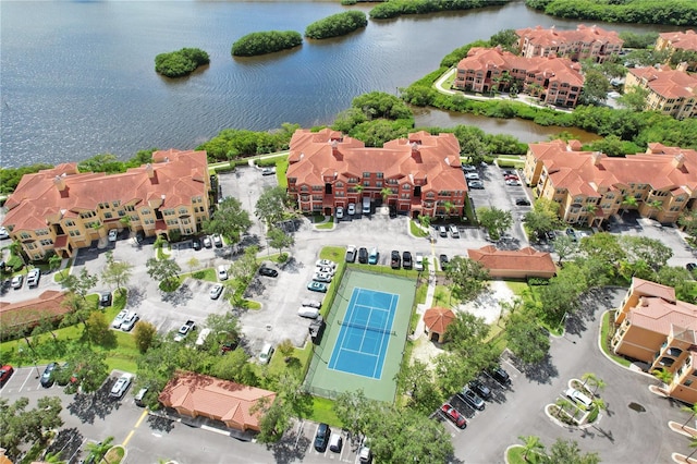 birds eye view of property with a water view