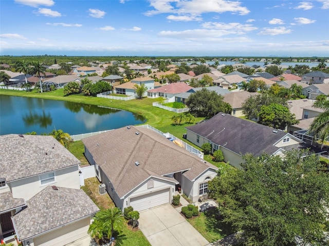 bird's eye view featuring a water view and a residential view