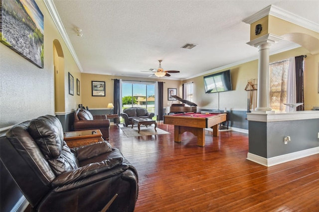 playroom featuring ornate columns, a ceiling fan, visible vents, and hardwood / wood-style floors