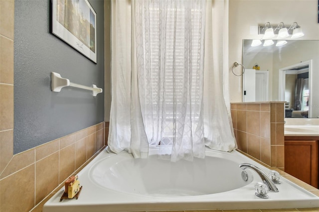 full bathroom with a garden tub and vanity