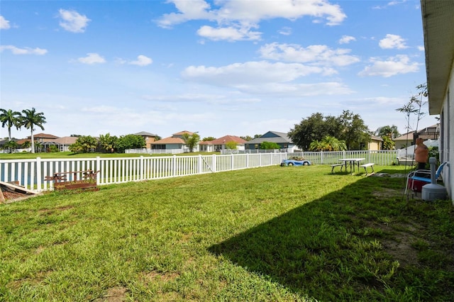 view of yard featuring a residential view and fence