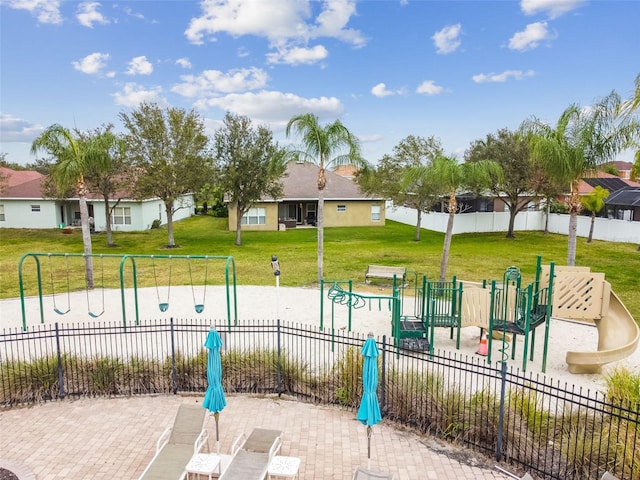 surrounding community featuring playground community, a yard, and fence