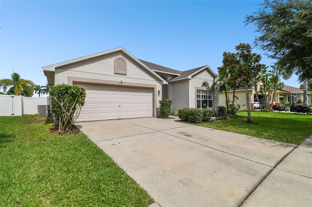 single story home with a garage, concrete driveway, a front lawn, central AC, and stucco siding