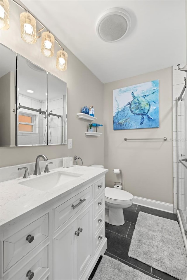 bathroom featuring vanity, toilet, an enclosed shower, and tile patterned floors