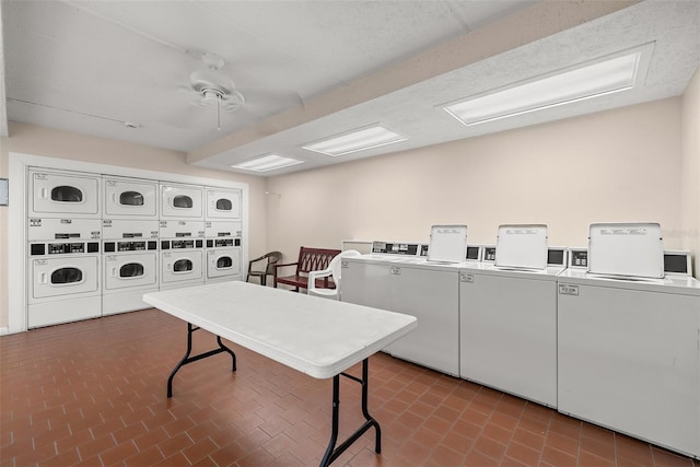 laundry room featuring ceiling fan, separate washer and dryer, and stacked washer / dryer