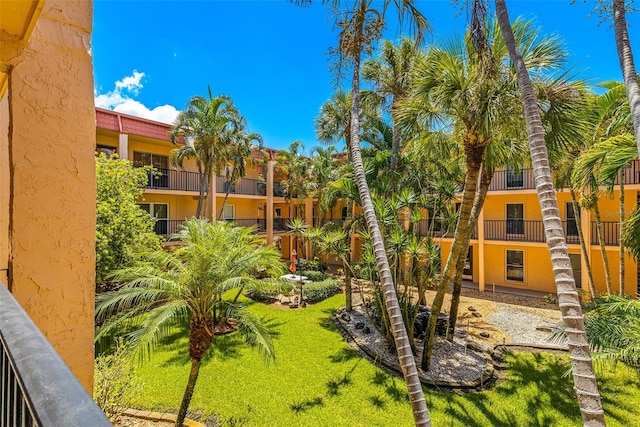 view of yard featuring a balcony