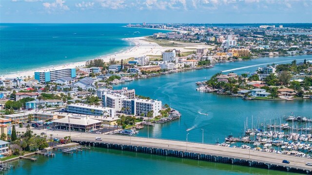 bird's eye view featuring a water view and a view of the beach