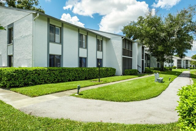 surrounding community featuring a yard