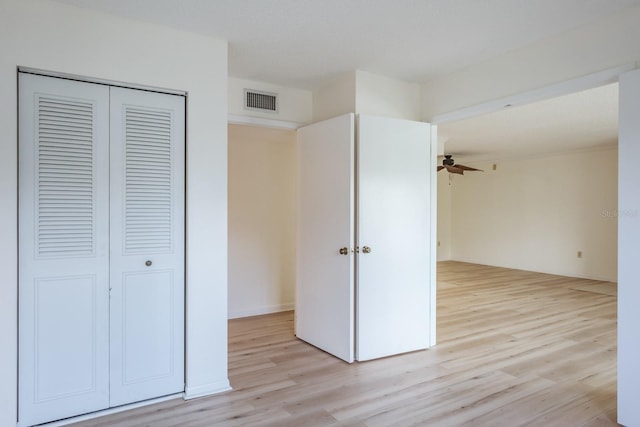 interior space featuring a closet and light hardwood / wood-style floors