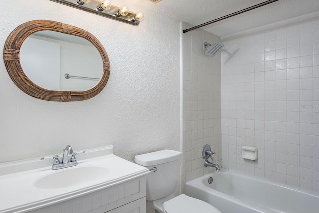 full bathroom featuring vanity, toilet, and tiled shower / bath