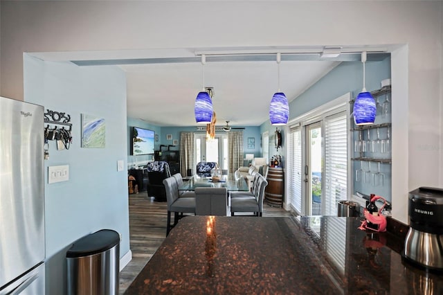 dining area featuring french doors and wood finished floors