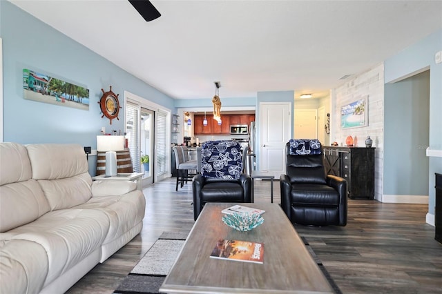 living room with baseboards and dark wood finished floors