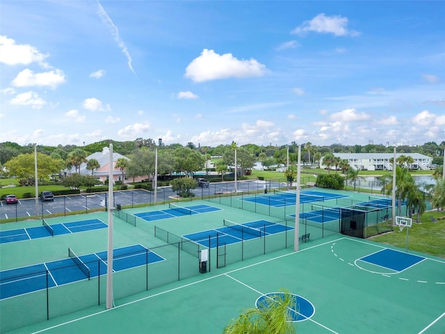 view of tennis court with fence