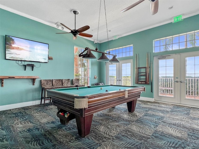 recreation room with french doors, crown molding, a textured ceiling, and baseboards