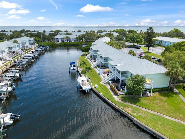 birds eye view of property featuring a water view and a residential view