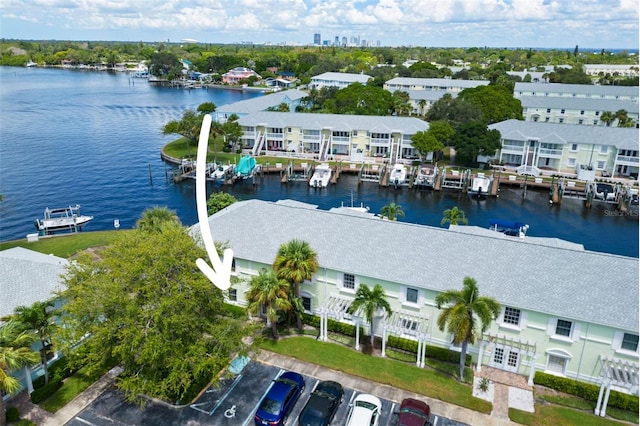 bird's eye view featuring a water view and a residential view