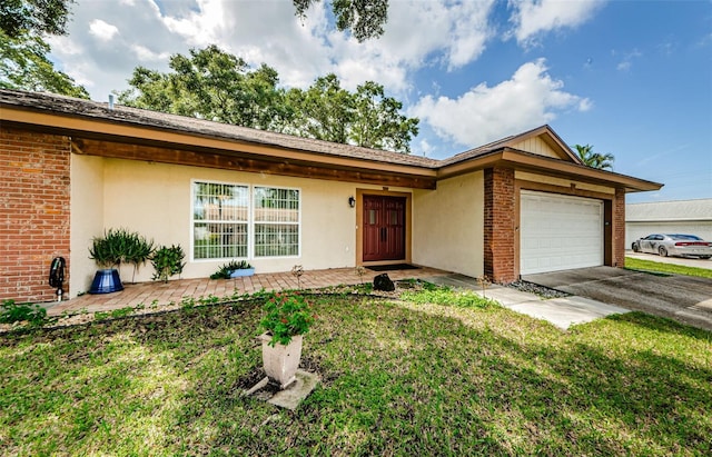 2208 Citrus Valley Cir, Palm Harbor, FL 34683 - ranch-style house with driveway, a front yard, stucco siding, brick siding, and a garage