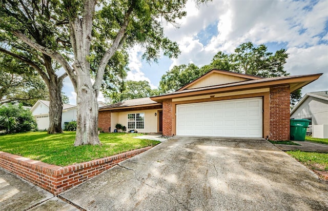 ranch-style home with a front lawn and a garage