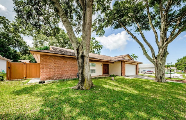 2208 Citrus Valley Cir, Palm Harbor, FL 34683 - view of front of property featuring brick siding, driveway, a garage, and a front lawn