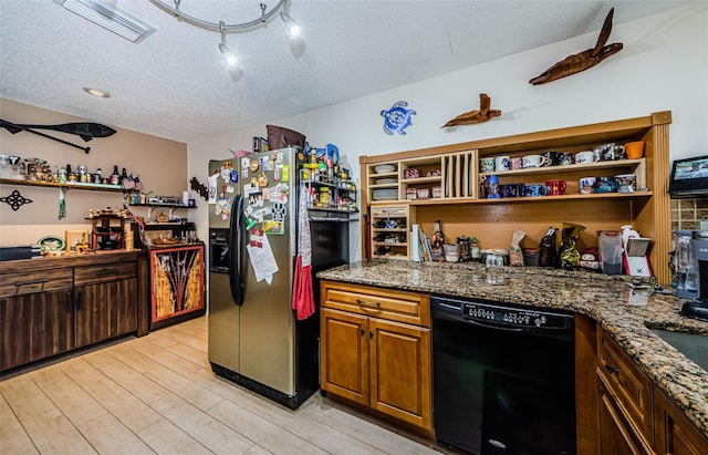 kitchen featuring a textured ceiling, stainless steel fridge with ice dispenser, dark stone countertops, black dishwasher, and light hardwood / wood-style floors