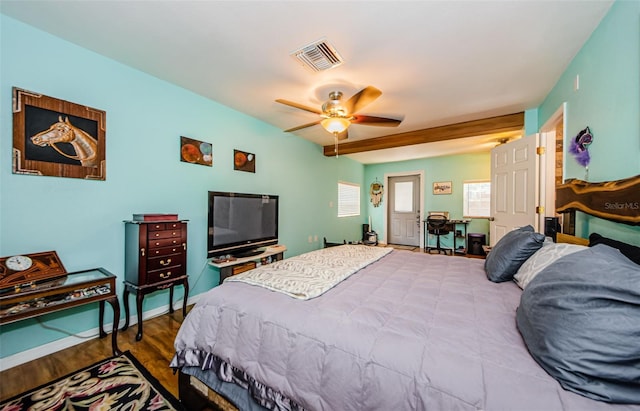2208 Citrus Valley Cir, Palm Harbor, FL 34683 - bedroom with baseboards, visible vents, multiple windows, and wood finished floors