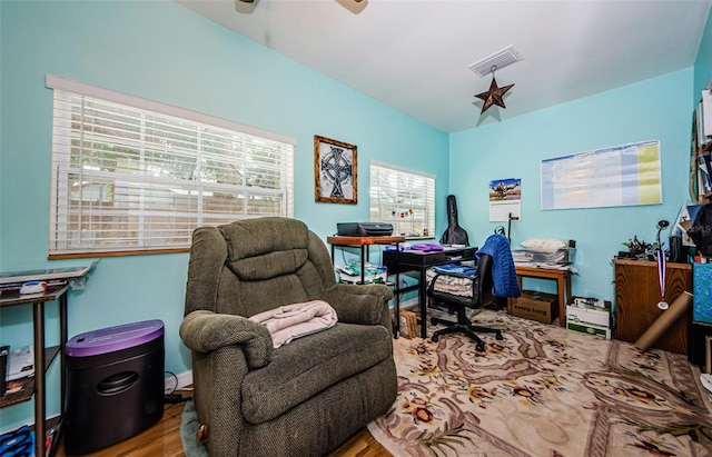 office area with light hardwood / wood-style floors and ceiling fan