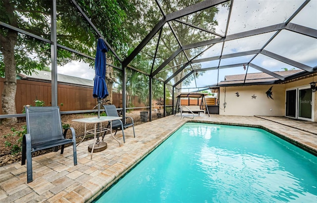 2208 Citrus Valley Cir, Palm Harbor, FL 34683 - view of swimming pool with a fenced backyard, glass enclosure, a patio, and a fenced in pool