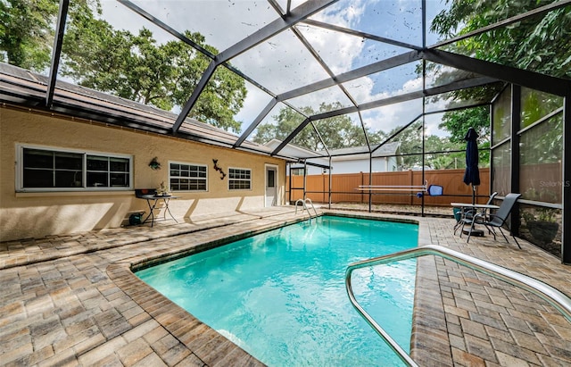 2208 Citrus Valley Cir, Palm Harbor, FL 34683 - view of swimming pool featuring a patio, fence, a fenced in pool, and glass enclosure