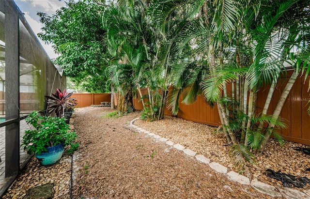 2208 Citrus Valley Cir, Palm Harbor, FL 34683 - view of yard featuring a fenced backyard and a lanai