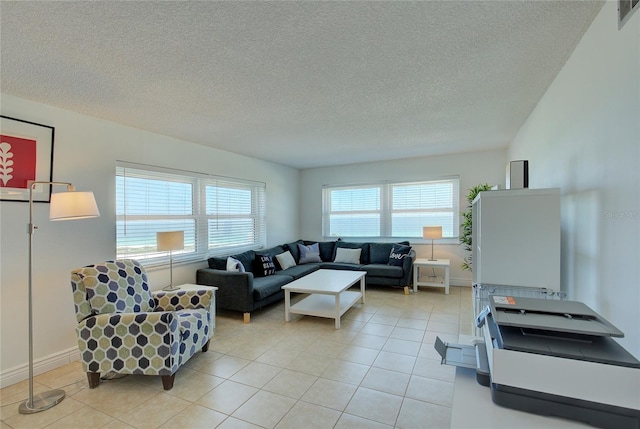 living room with a textured ceiling and light tile patterned floors