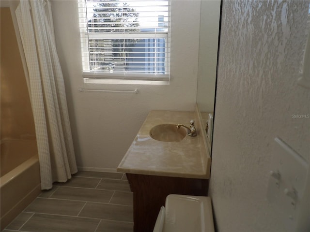 bathroom with vanity and shower / bathtub combination with curtain