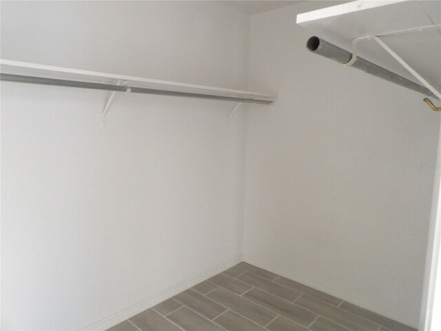 spacious closet featuring hardwood / wood-style floors