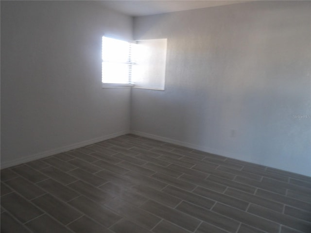 empty room featuring dark wood-type flooring