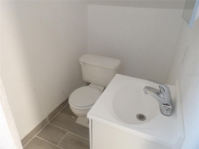 bathroom with toilet and vanity