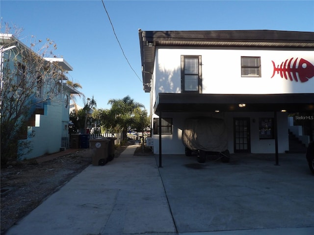 back of house with a carport