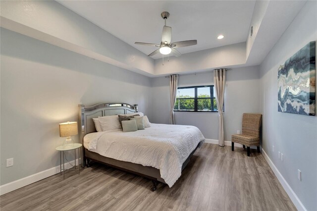 bedroom featuring ceiling fan and wood-type flooring