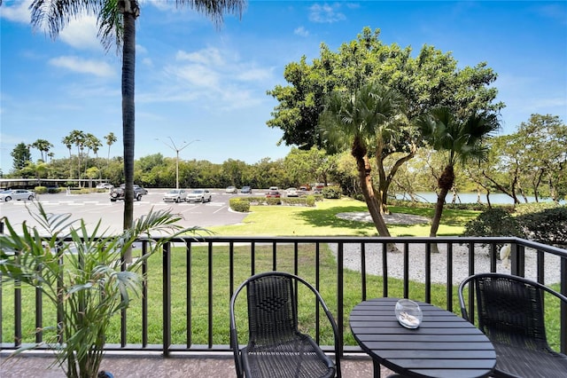 wooden deck featuring a yard