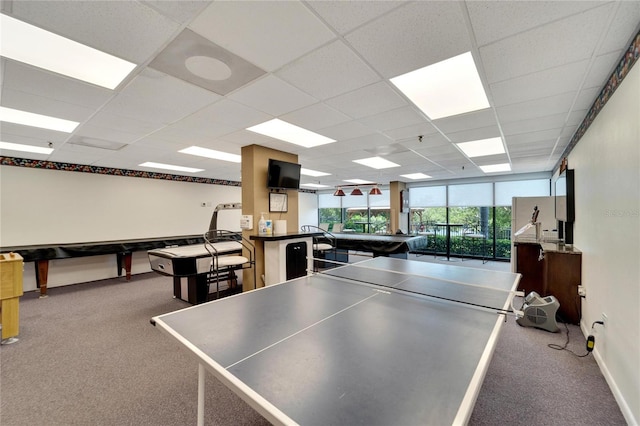 game room featuring a paneled ceiling and carpet flooring