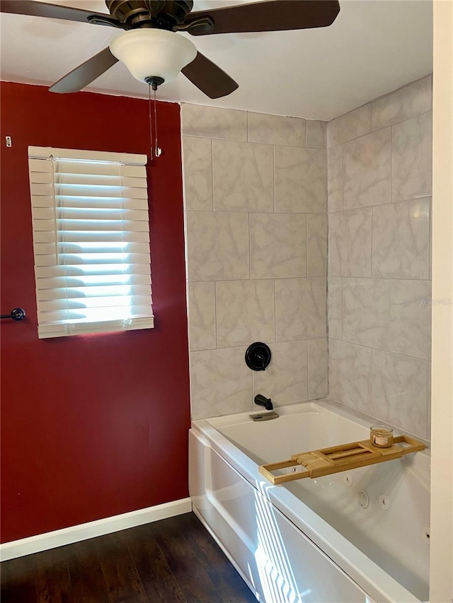 bathroom featuring ceiling fan, shower / bath combination, and hardwood / wood-style floors