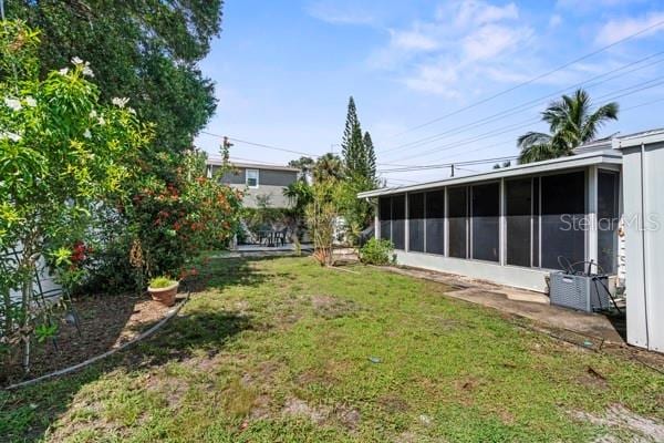 view of yard with a sunroom