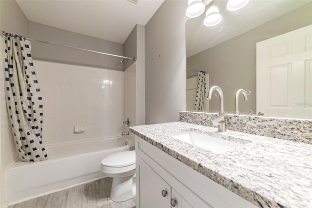 full bathroom featuring shower / tub combo, vanity, toilet, and wood finished floors