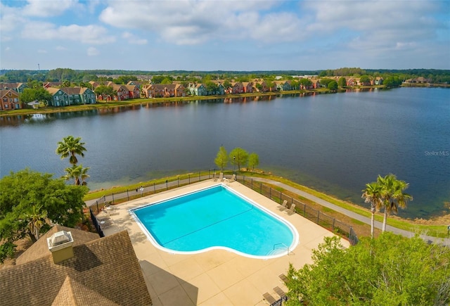 view of pool with a water view, fence, and a fenced in pool