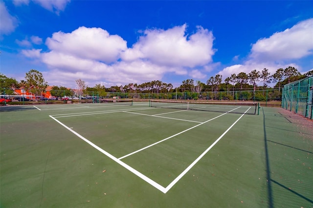 view of sport court with fence