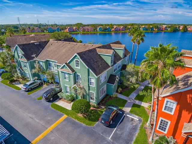 birds eye view of property with a water view