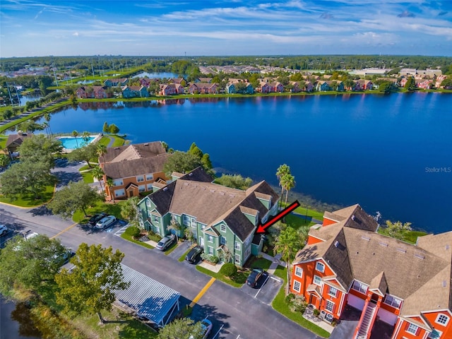 birds eye view of property with a residential view and a water view