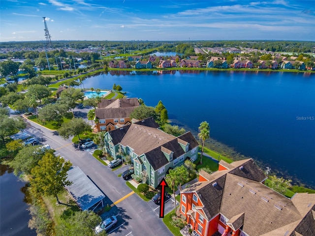 birds eye view of property with a water view