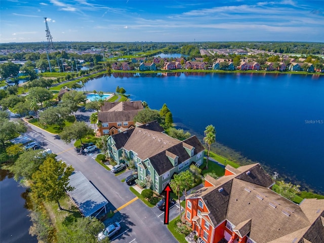 birds eye view of property with a water view and a residential view