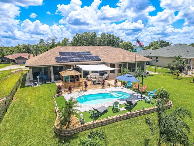 view of pool with a lawn and a patio