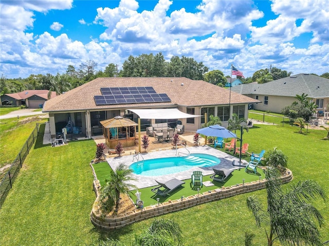 10177 Sunburst Ct, Spring Hill, FL 34608 - back of property with a sunroom, a patio area, and a gazebo